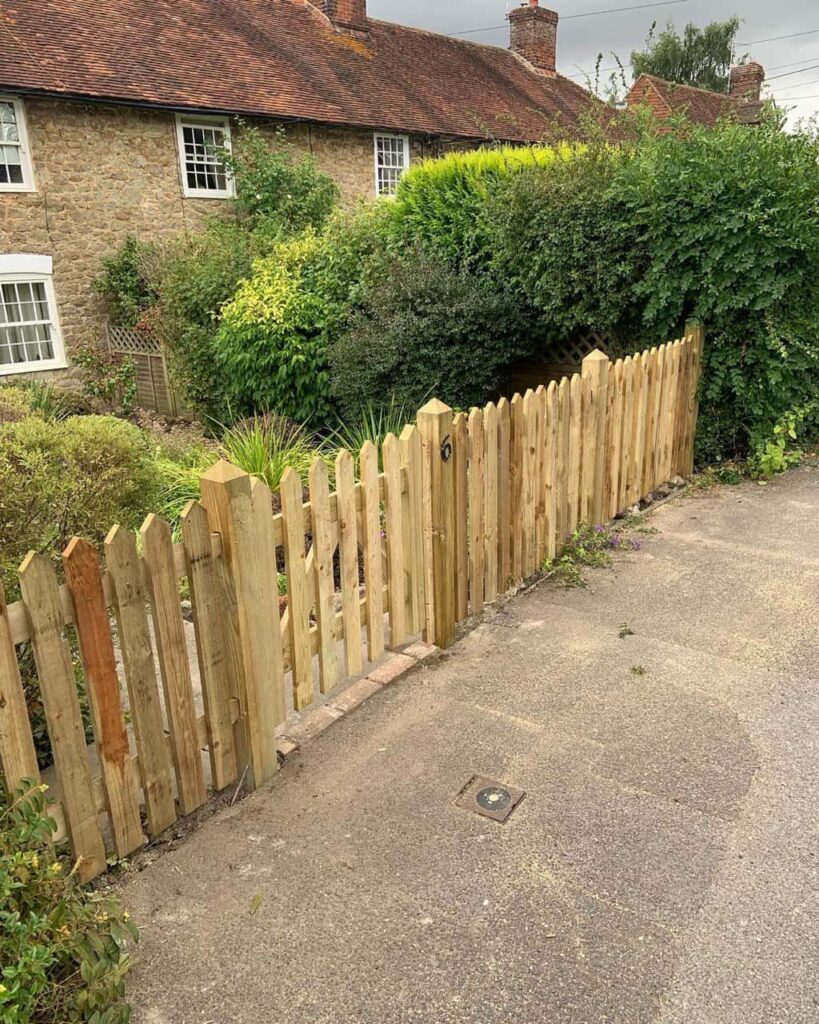This is a photo of a picket fence and picket gate installed by Fast Fix Fencing Hethersett