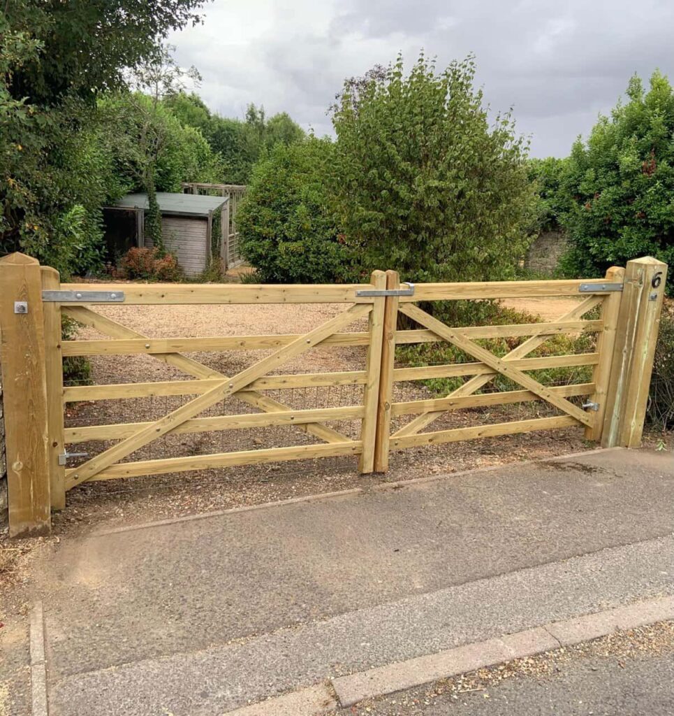 This is a photo of a wooden driveway gate installed by Fast Fix Fencing Hethersett